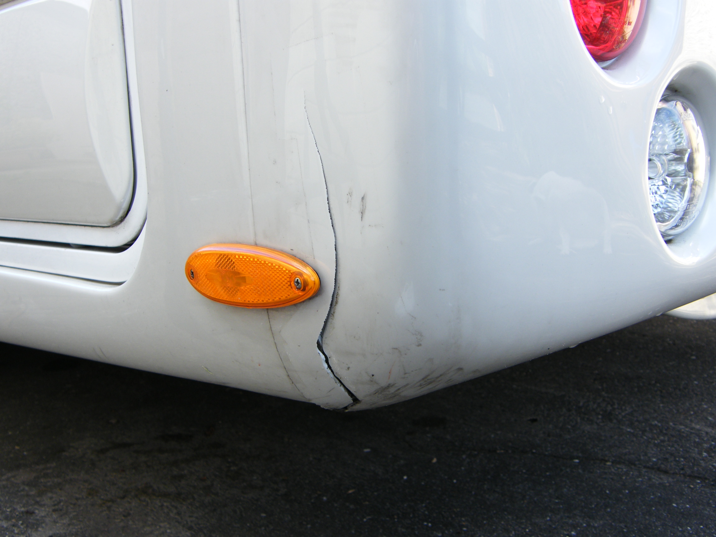 4 - Cracked side of bumper.JPG