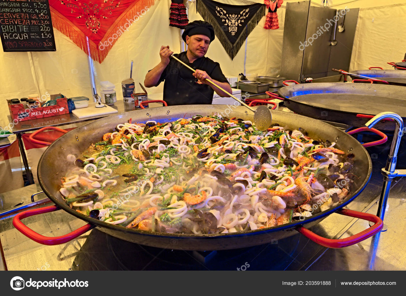 depositphotos_203591888-stock-photo-spanish-chef-prepares-seafood-paella.jpg